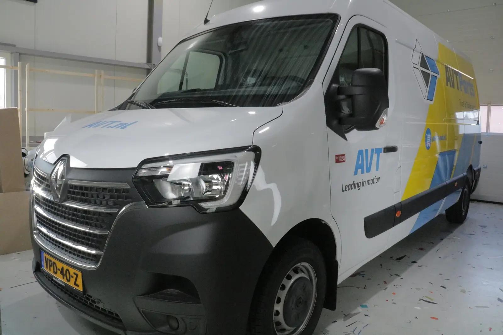 AVT Parts company van with yellow and light blue graphics