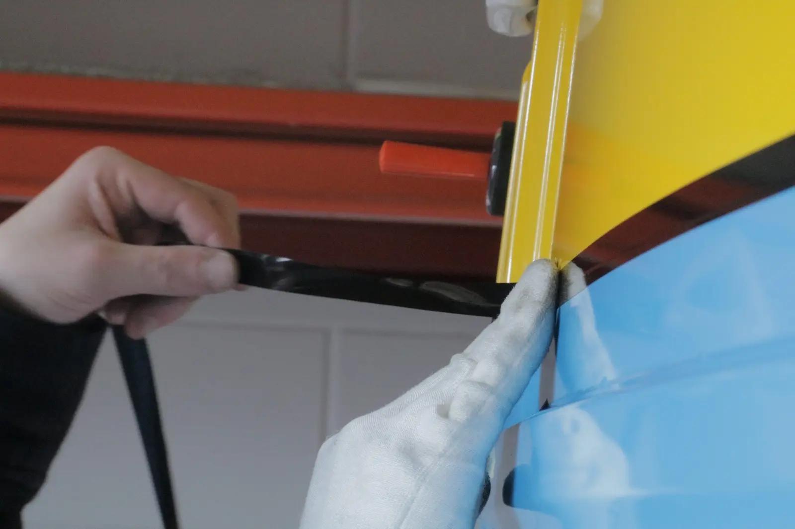 Careful film finishing along a bodywork edge
