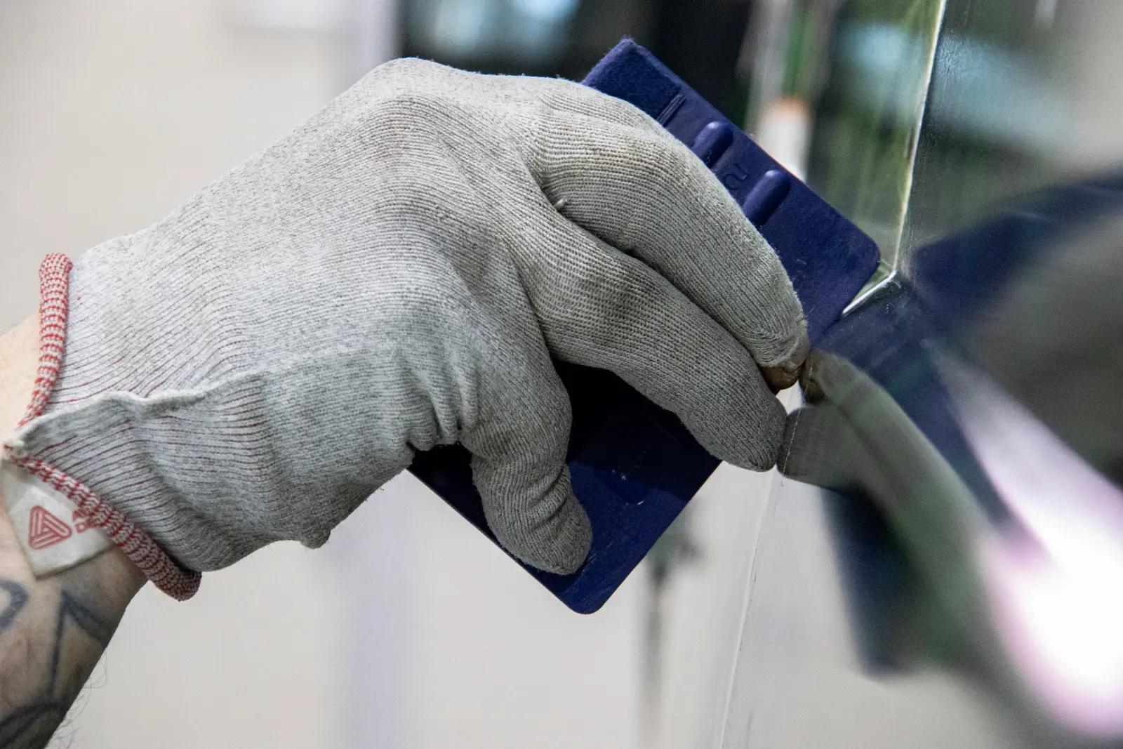 Finishing wrap film around a bodywork edge