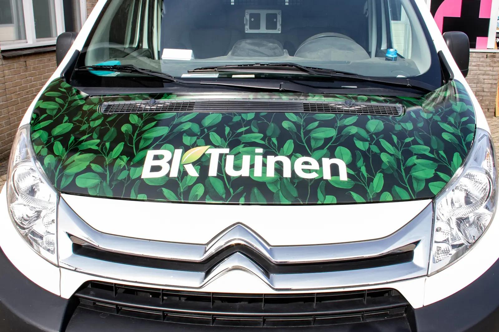 Green bonnet with BK Tuinen logo