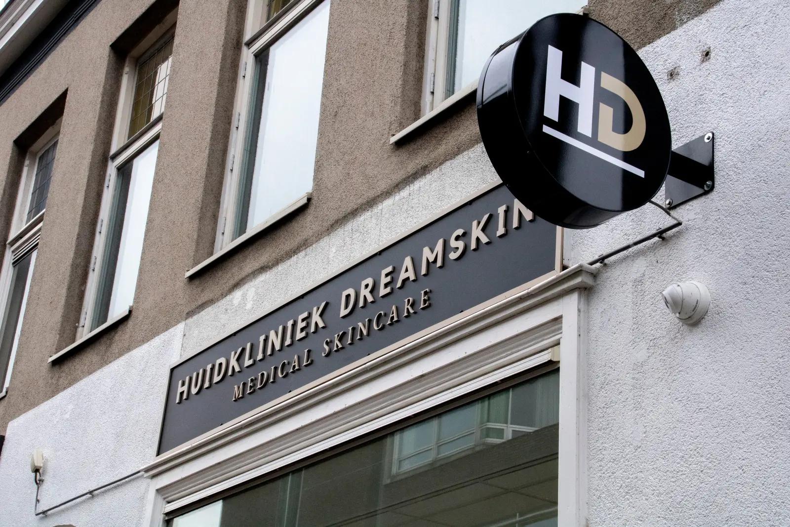 Exterior lettering and projecting lightbox along the street