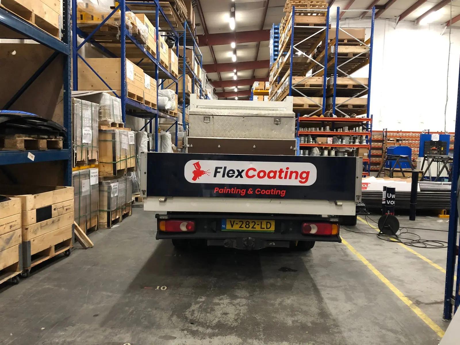 FlexCoating logo on the tailgate of a work vehicle.