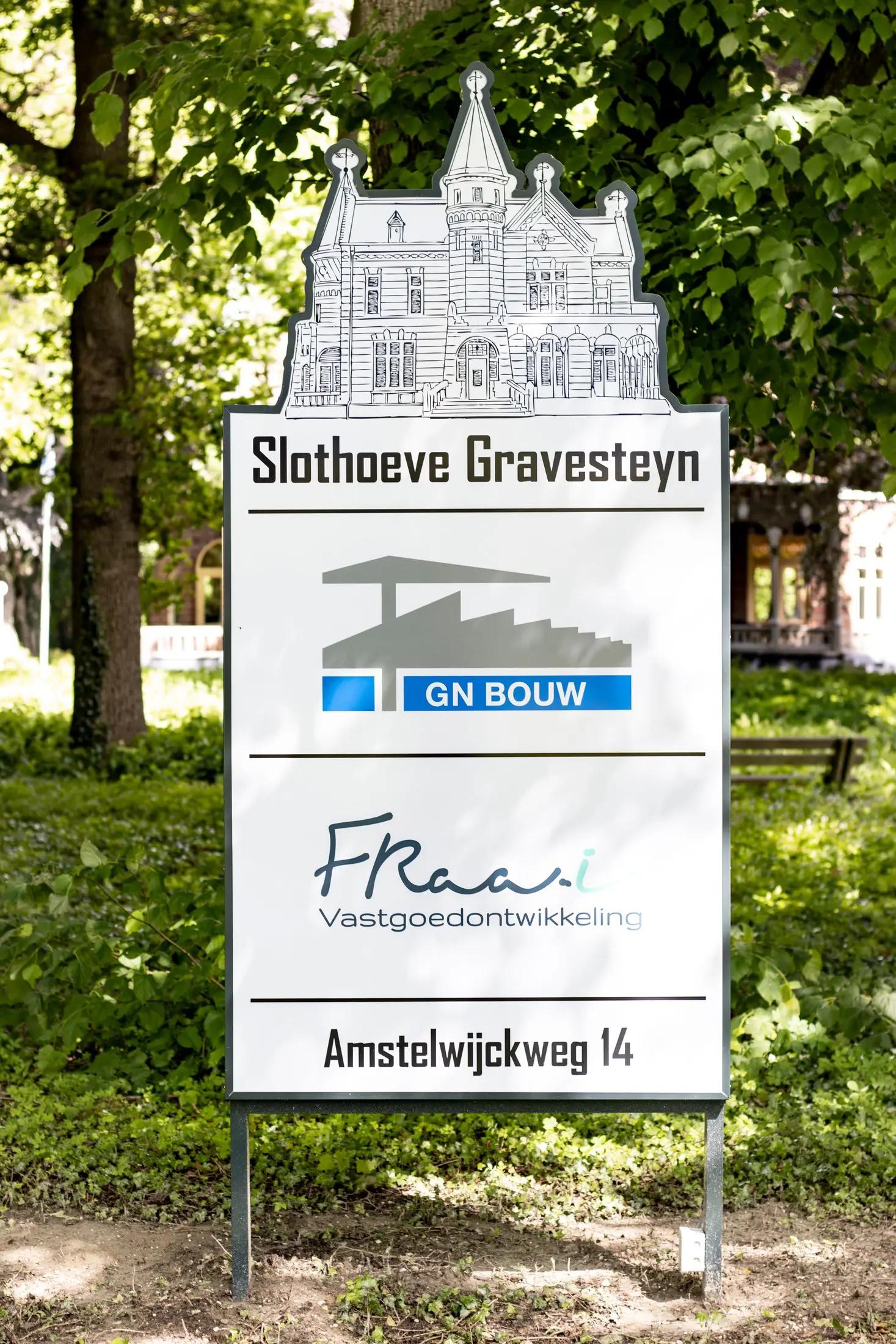Entrance sign with building illustration and address