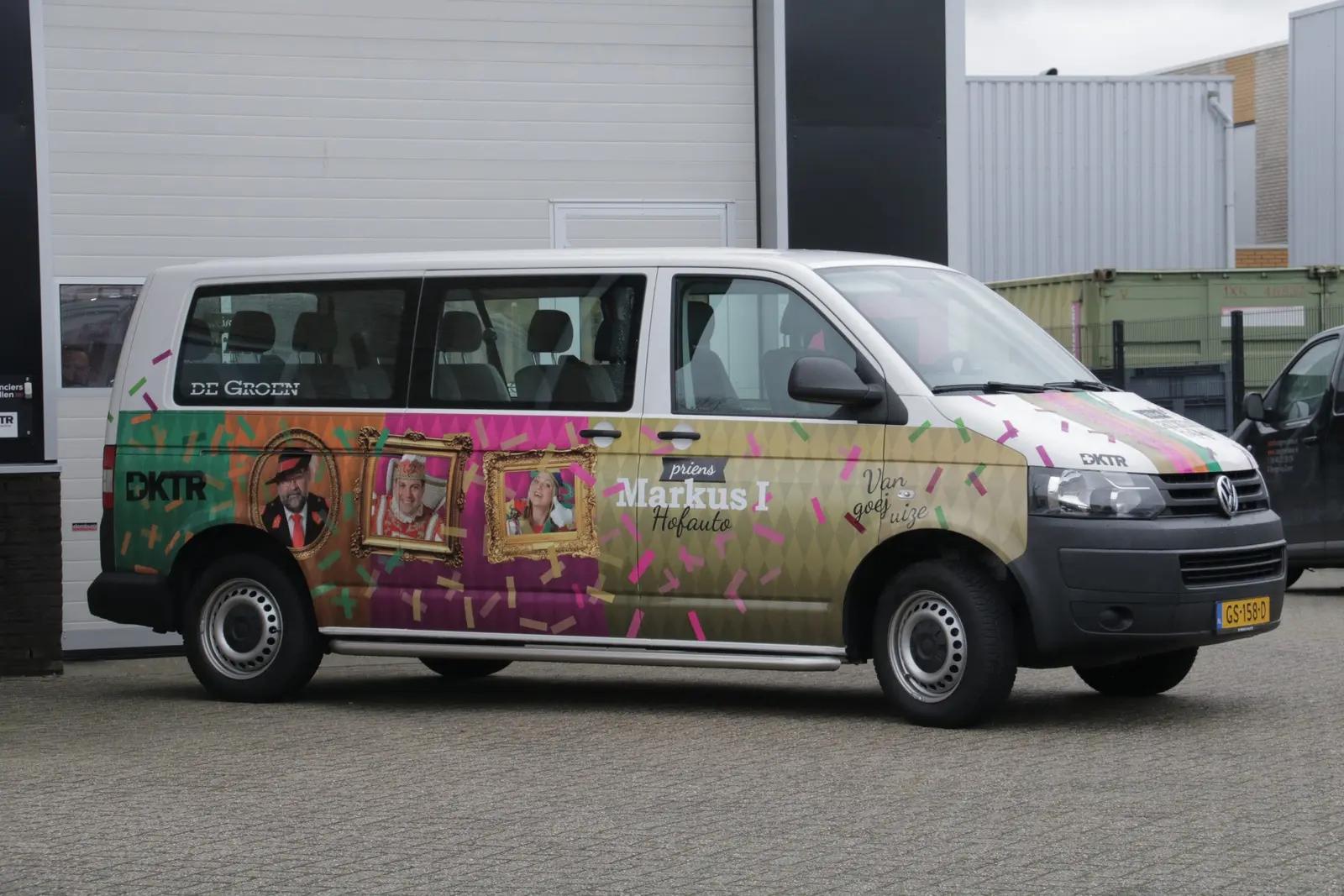 Side of the official carnival van with portraits and decorative frames