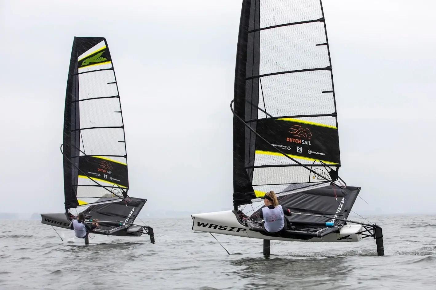 Two WASZP sailing boats with DutchSail sponsor graphics on their sails