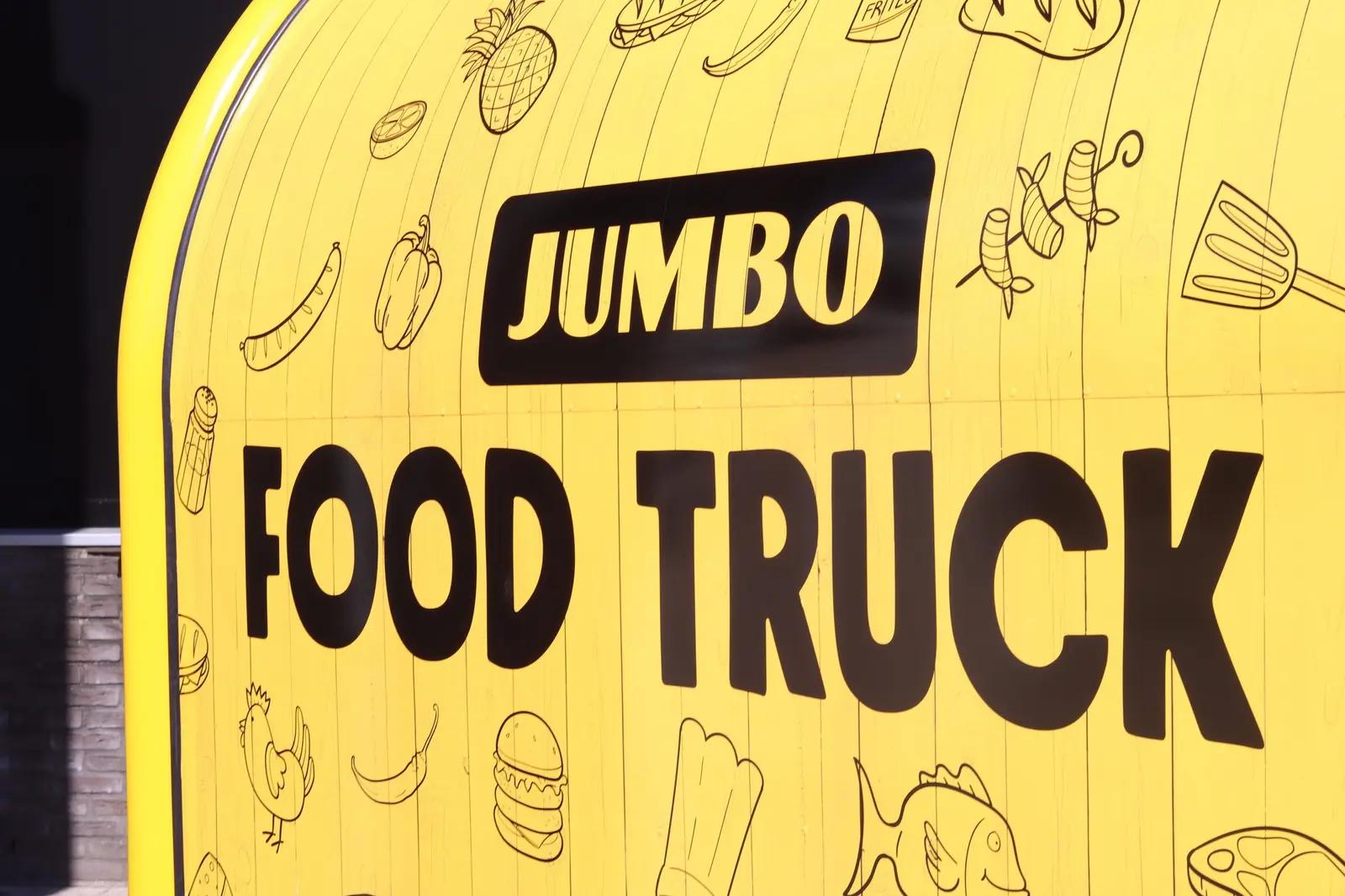 Black Jumbo Food Truck lettering on the yellow surface