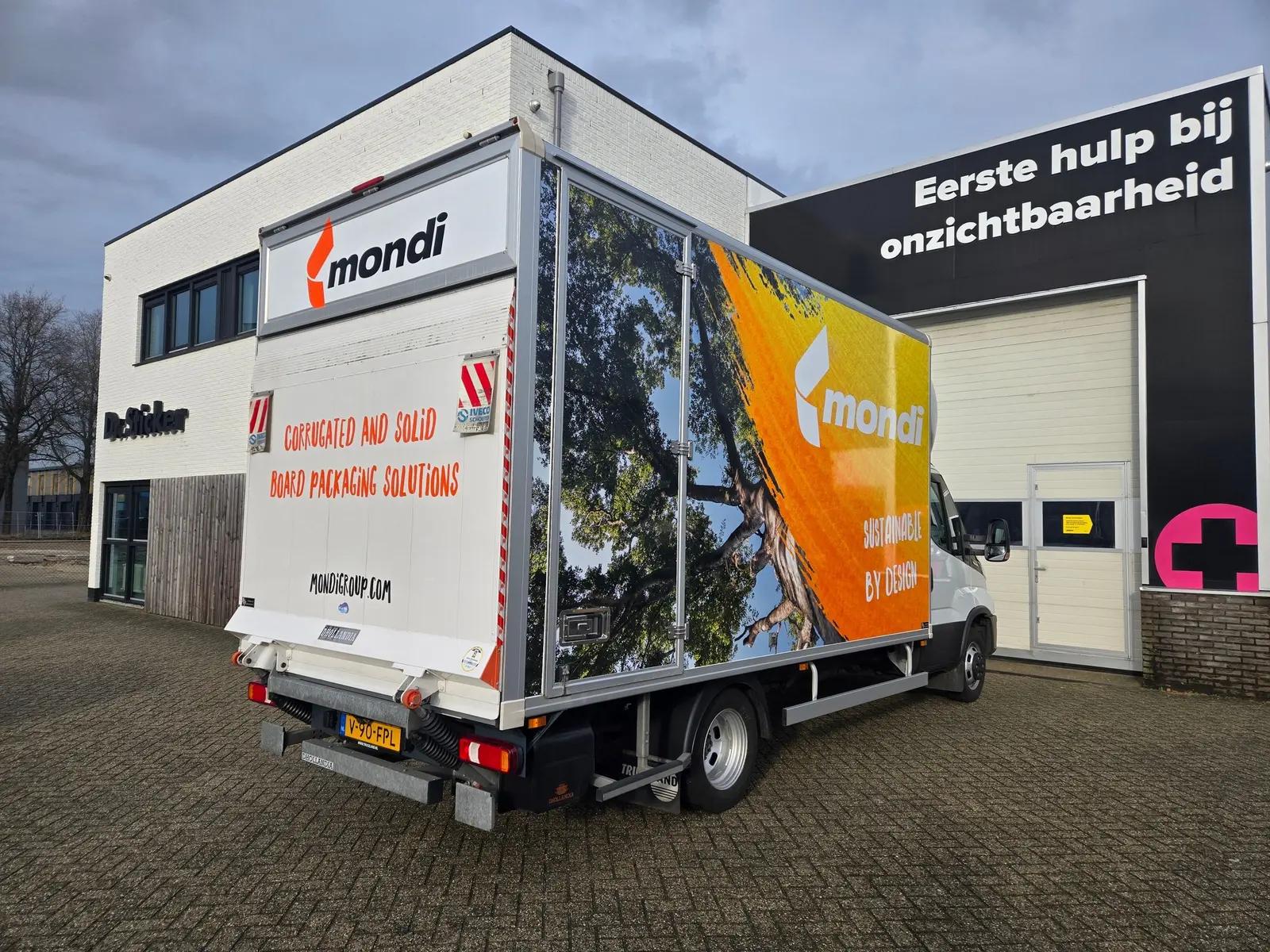 Mondi Iveco box van viewed from the rear corner, showing graphics on the body and rear doors.