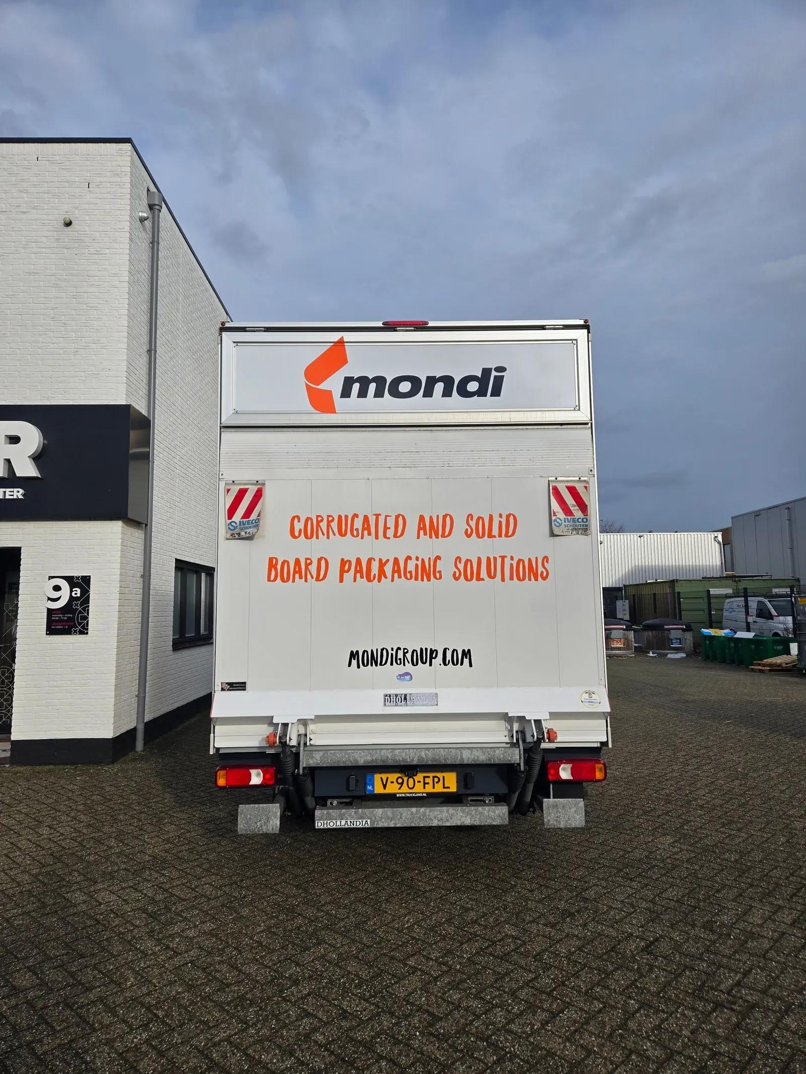 Rear doors of the Mondi box van with the logo and orange lettering on a white background.