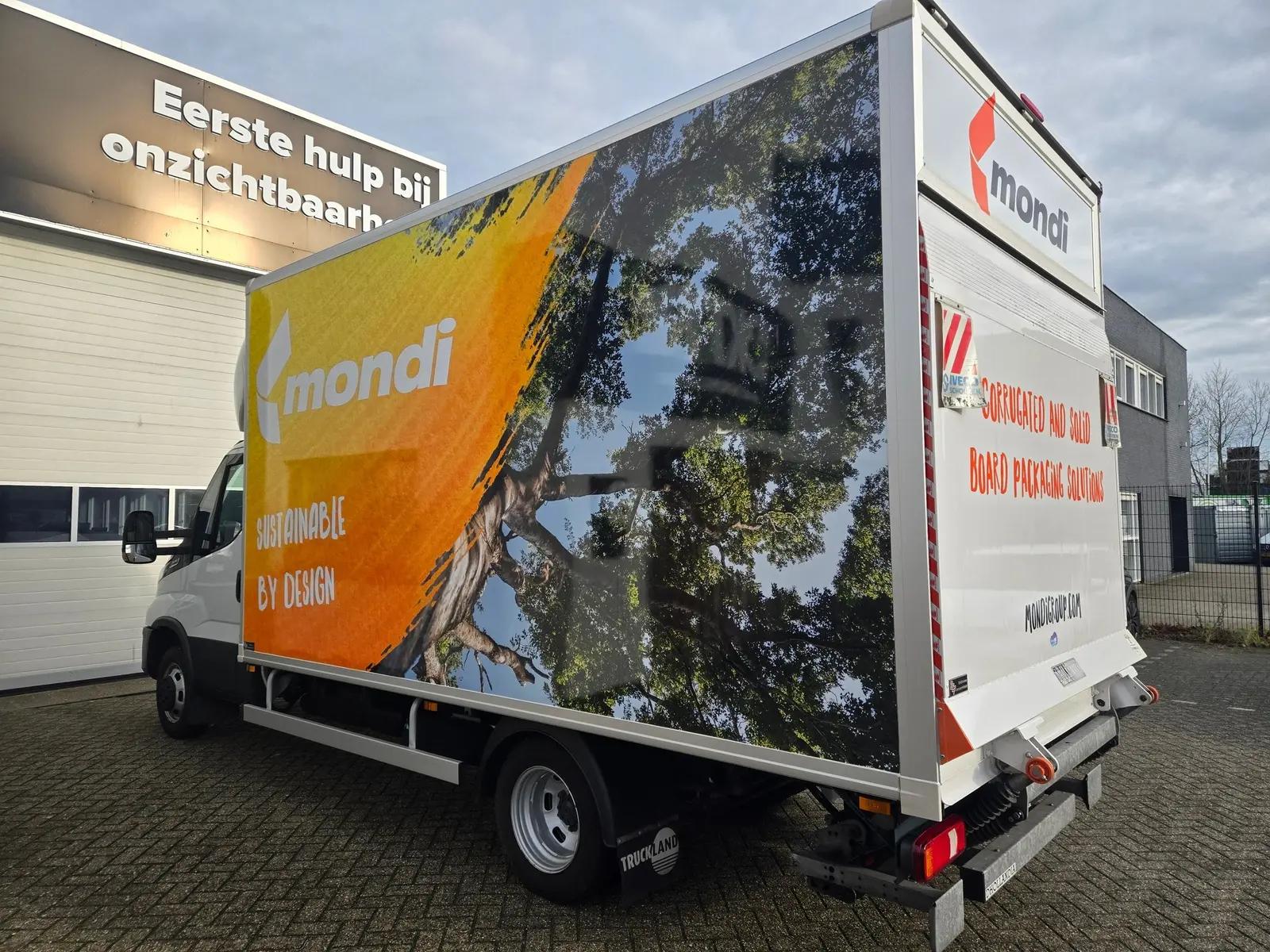 Rear corner view of the Mondi box van, showing consistent branding across the side and rear.