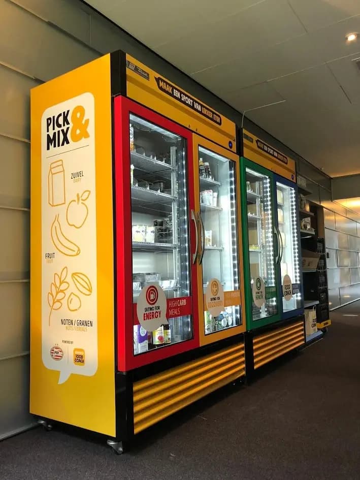 Yellow refrigeration units with coloured door frames and branded graphics