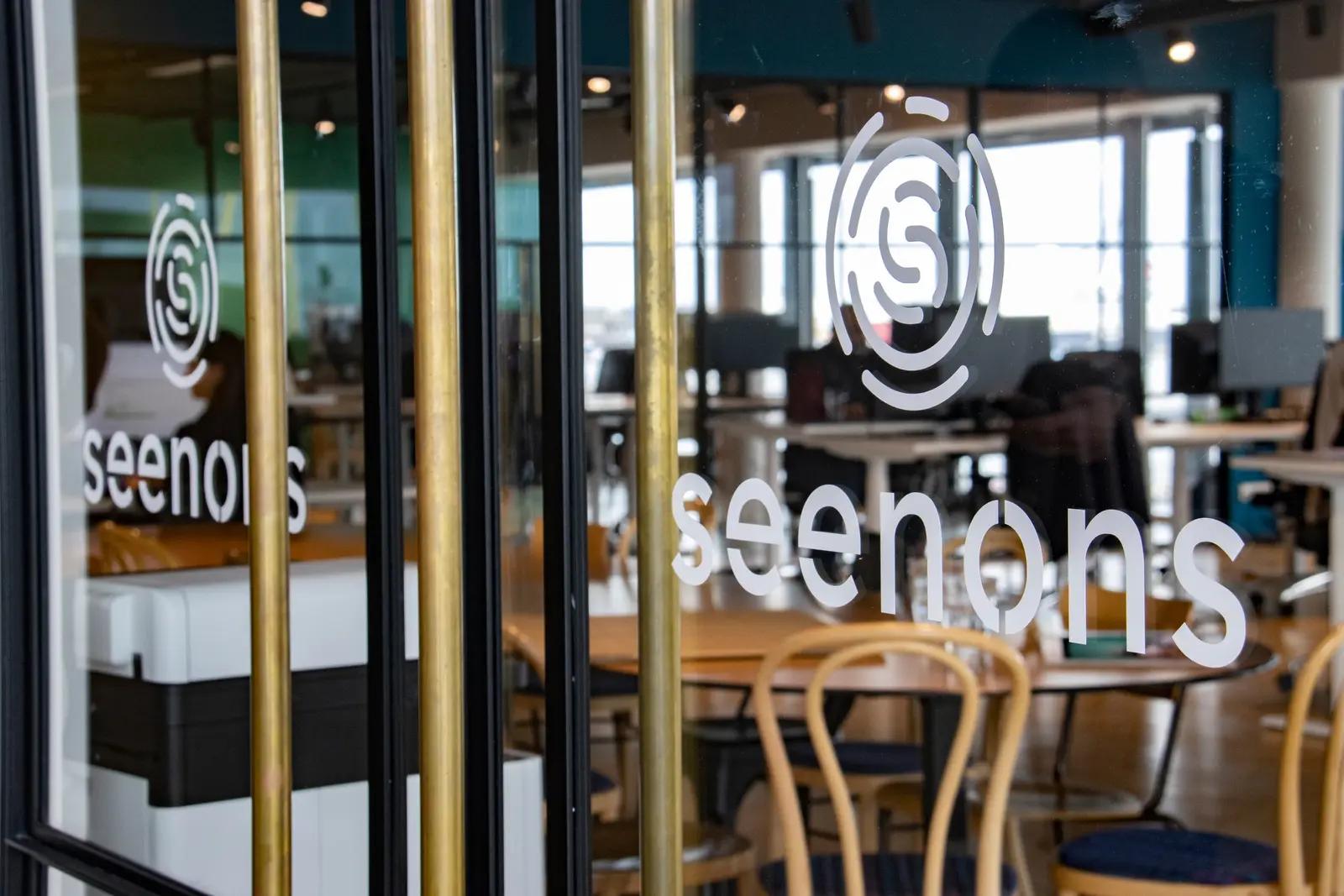 White Seenons logos on glass office doors